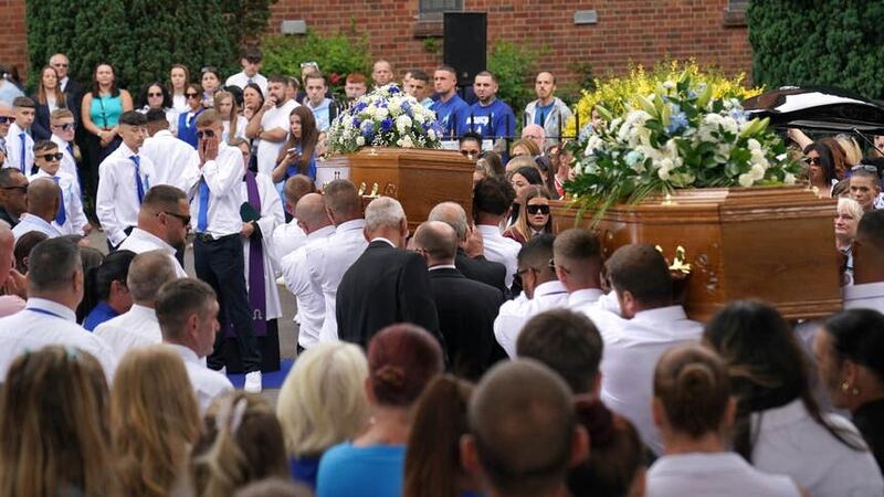 The coffins of Kyrees Sullivan and Harvey Evans are carried into the Church of the Resurrection in Ely (Jacob King/PA)