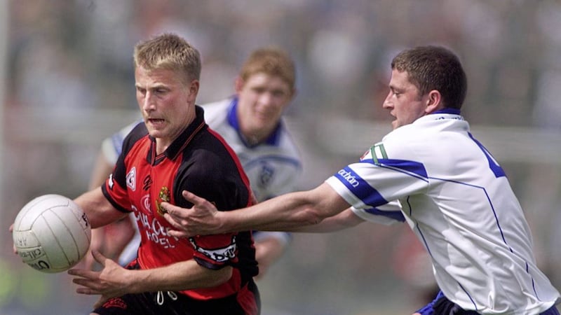 Monaghan&#39;s Pauric McKenna closes in on Down&#39;s Micheal Walsh 