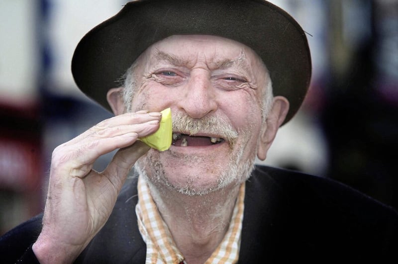 Donald Cassey from Armoy enjoys some yellowman at the Lammas Fair in Ballycastle. Picture by Hugh Russell