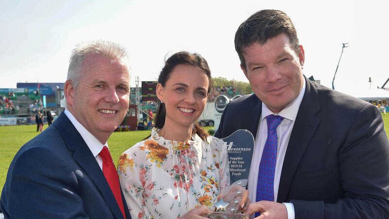 Ashley Orr, Willowbrook Foods receives the overall Local Supplier of the Year Award from Paddy Doody, and Neal Kelly, Henderson Group 
