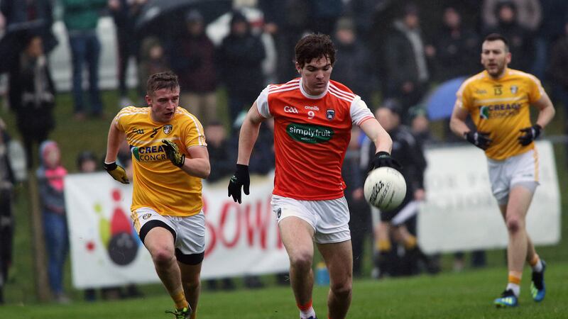 Armagh's   Jarlath Og Burns strides away from Antrim's  Patrick  Branagan       in yesterday's Dr McKenna Cup game at Glenavy.<br /> Picture by Seamus Loughran