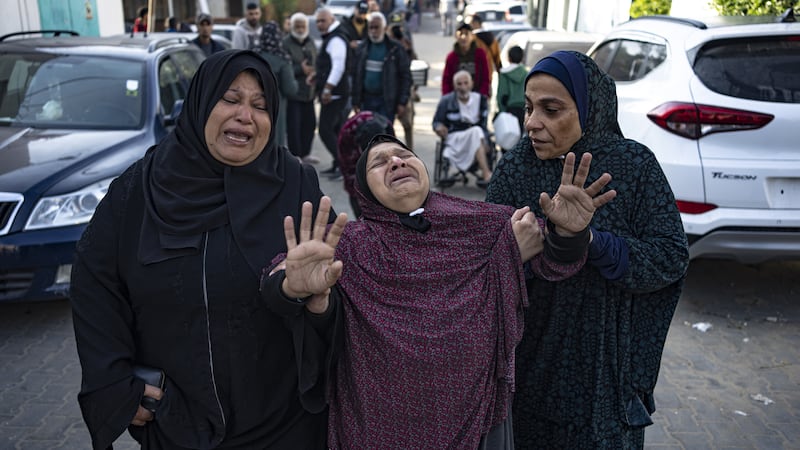 Palestinians mourn their relatives killed in the Israeli bombardment of the Gaza Strip, in the hospital in Khan Younis (Fatima Shbair/AP)