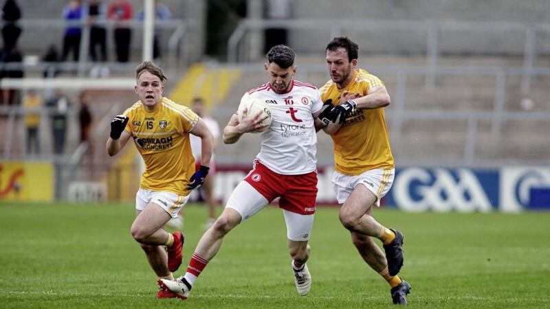 Tyrone&#39;s Mattie Donnelly evades Antrim&#39;s Odhran Eastwood and Patrick Gallagher at the Athletic Grounds in Armagh on Saturday May 25 2019. Picture by Seamus Loughran. 