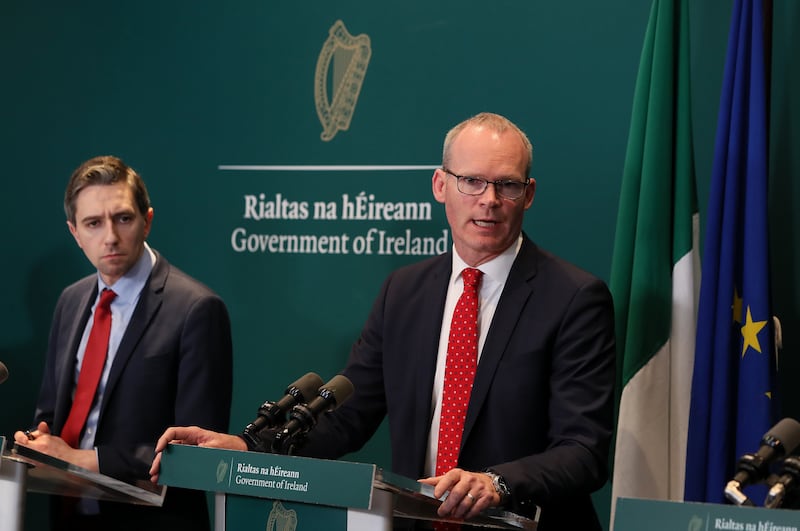 Simon Harris and Simon Coveney at a news conference in 2020