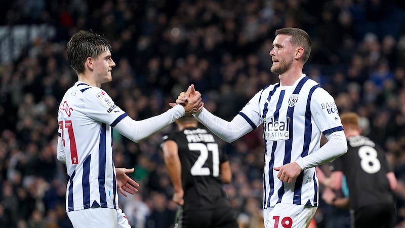John Swift (right) celebrates after scoring West Brom’s second