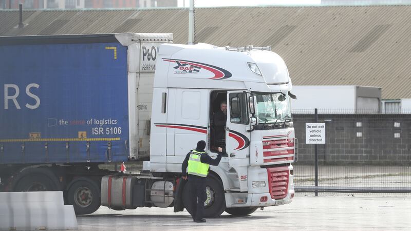A Border Force officer talks to a lorry driver at the Department of Agricultural, Environment and Rural Affairs facility on Duncrue Street near Belfast Harbour