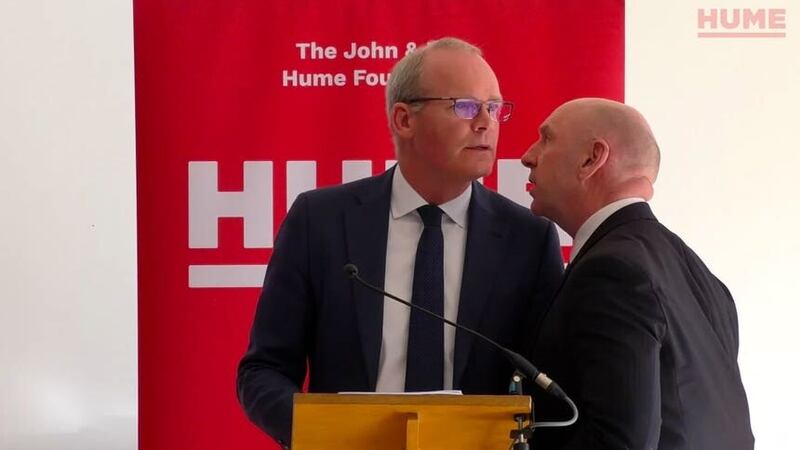 Irish Foreign Affairs Minister Simon Coveney is ushered from a room due to a security alert whilst he was speaking at a peacebuilding event organised by the John and Pat Hume Foundation at The Houben Centre in Belfast (Hume Foundation/PA)