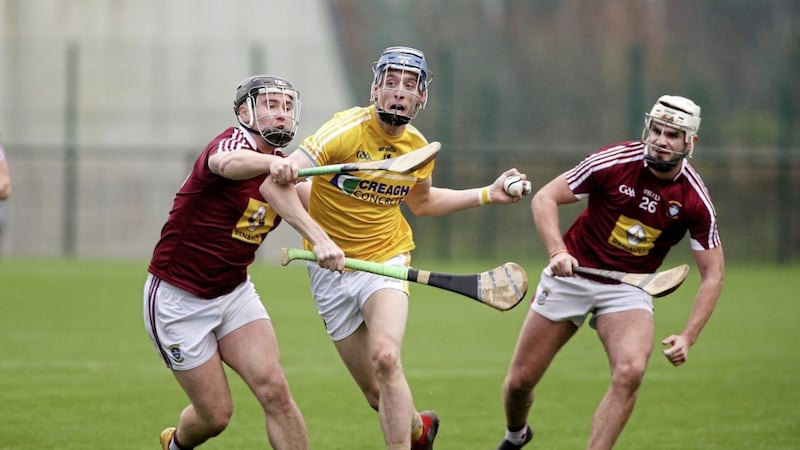 Antrim&#39;s James McNaughton in action against Westmeath duo Conor Shaw and Shane Clavin in Saturday&#39;s Kehoe Cup final at Abbotstown Picture by Seamus Loughran 