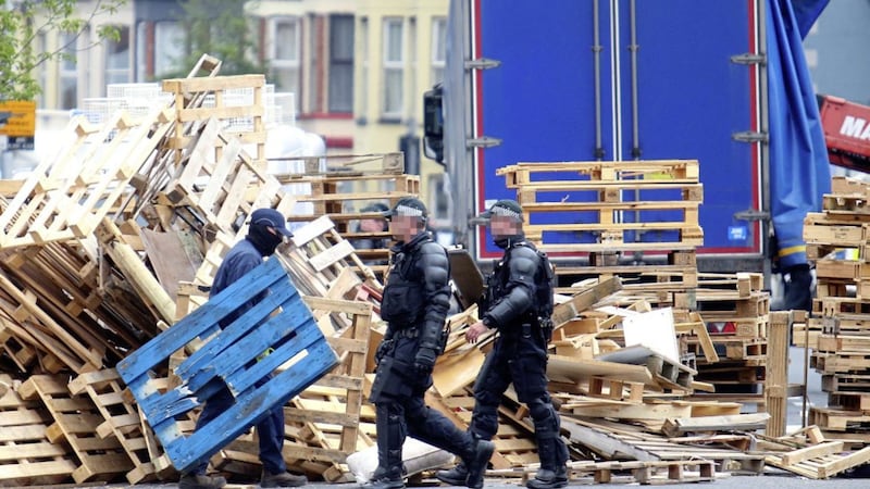 Police and contractors move into Cluan Place in east Belfast to remove a loyalist bonfire from the road on July 11. Picture Mal McCann. 
