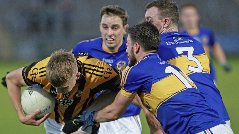 Brian Fox (centre) combines with Stefan Forker to tackle Crossmaglen&#39;s Oisin O&#39;Neill. Picture Bill Smyth. 