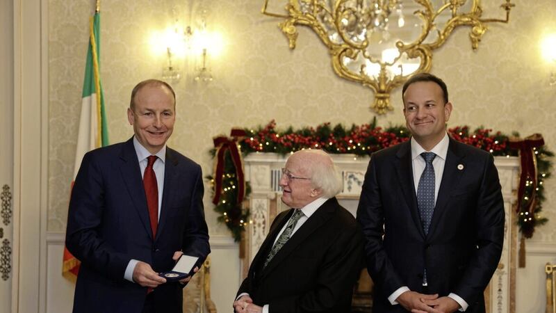 Outgoing Taoiseach Miche&aacute;l Martin with his successor Leo Varadkar and President Michael D Higgins at Aras an Uachtarain in Dublin on Saturday. Photo: Nick Bradshaw/PA Wire 