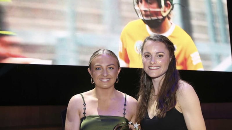 Antrim's Roisin McCormick receives her Camogie Player of the Year Award from international athletics star and former Portaferry camog Ciara Mageean      Picture: Hugh Russell