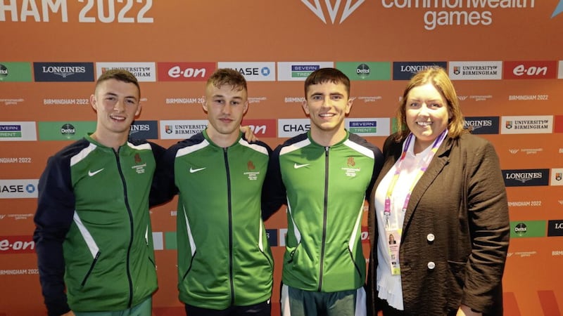 MEDALS: From left, Team NI gymnasts Rhys McClenaghan who won a silver medal, Ewan McAteer and Eamon Montgomery at the Commonwealth Games in Birmingham with Communities Minister Deirdre Hargey 