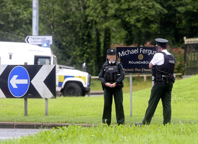 Police and army bomb disposal officers at the scene of a security alert near he Michael Ferguson Roundabout in west Belfast Picture Mal McCann. 