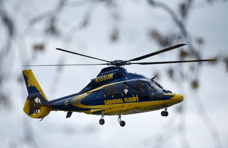 A University of Michigan Health Systems Survival Flight responds to the Swan Creek Boat Club after the incident (Kathleen Kildee/Detroit News via AP)