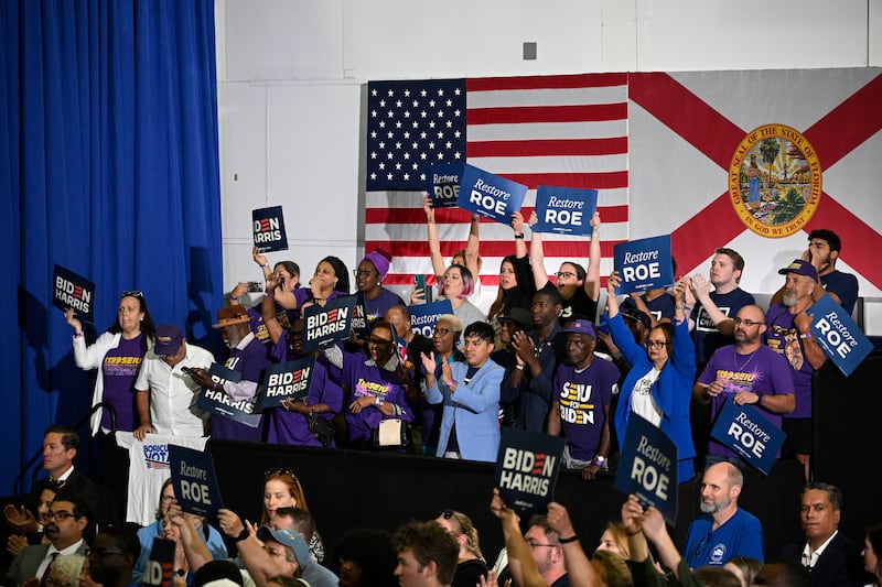 Supporters cheer as US President Joe Biden speaks about reproductive freedom at Hillsborough Community College in Tampa, Florida (Phelan M Ebenhack/AP)