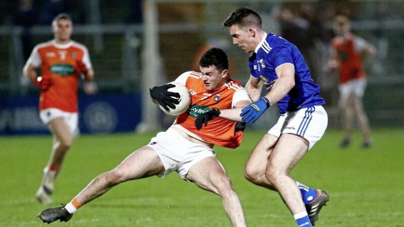 Armagh&#39;s Conor O&#39;Neill holds off Cavan&#39;s Killian Brady in the League opener. Laois brought Armagh&#39;s encouraging start to an end on Saturday night. Pic Philip Walsh.