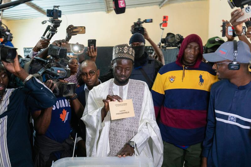Senegalese opposition candidate Bassirou Diomaye Faye casts his ballot (Stefan Kleinowitz/AP)