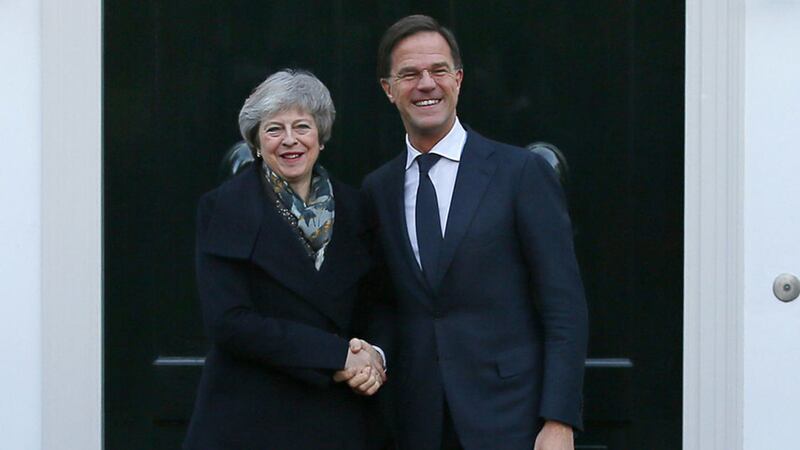 British Prime Minister Theresa May is greeted by Dutch Prime Minister Mark Rutte upon her arrival in The Hague, Netherlands this morning&nbsp;