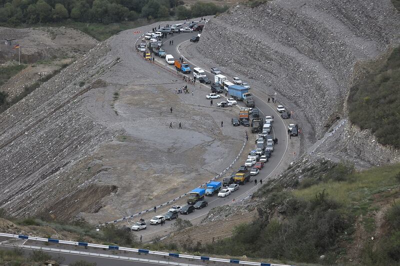 A convoy of cars of ethnic Armenians leaves Nagorno-Karabakh
