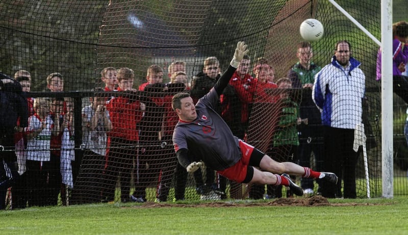 Lamh Dhearg keeper John Finucane in action against Cargin. Picture: Colm O'Reilly