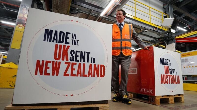 Trade minister Nigel Huddleston during a visit to a DHL facility to watch packages being sent to Australia and New Zealand under fresh trading terms (Jordan Pettitt/PA)