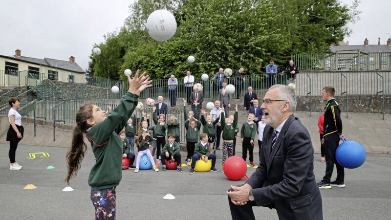 Back to school President of the GAA, Larry McCarthy has some fun with young Hayley Lanch during a visit to St Malachy PS Armagh Picture by Hugh Russell 