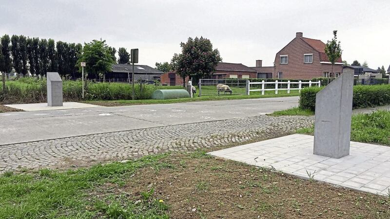 Memorial stones to 36th Ulster and 16th Irish divisions face each other outside Wytschaete Cemetery in Belgium. Picture by David Young, Press Association 
