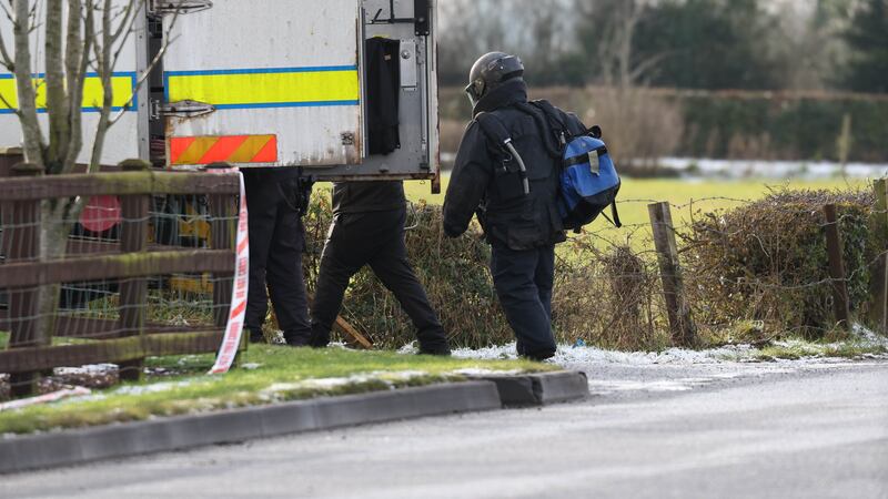 Police and ATO at the scene of a security alert on the Gortgonis Road in Coalisland on Friday due to a suspicious object.
PICTURE: COLM LENAGHAN
