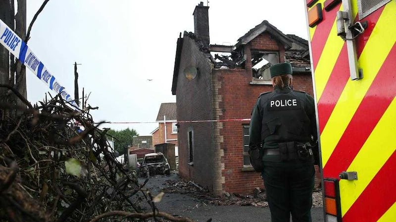 Police at the family home destroyed in a fire spread from a recycling centre in Rathfriland. Picture by Mal McCann 