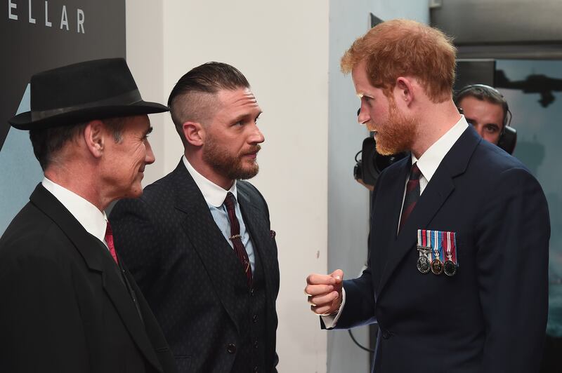 Prince Harry meets Sir Mark Rylance and Tom Hardy as he attends the Dunkirk premiere in London.