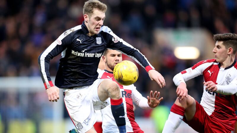 Dundee's Kevin Holt and Rangers' Emerson Hyndman battle for the ball during the Ladbrokes Scottish Premiership match at Dens Park, Dundee on Saturday February 19 2017 &nbsp;
