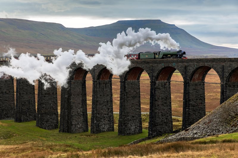 The Flying Scotsman passes over the Ribblehead viaduct 
