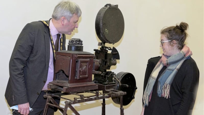 Museum services officer Sarah Carson shows Richard Holmes a projector used to show silent films in St Patrick&rsquo;s Hall in Ballymoney 