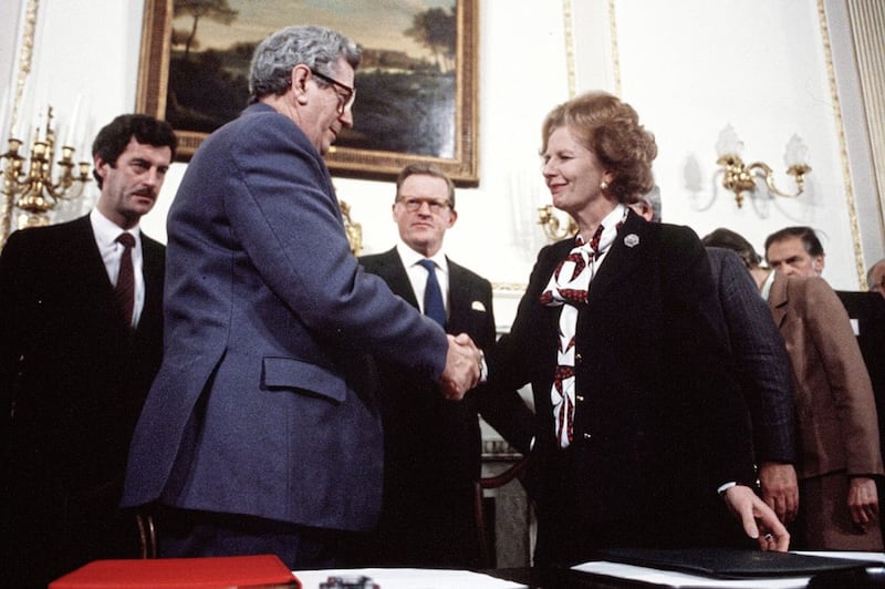 PACEMAKER BELFAST      ARCHIVE.1985.Secretary of State Tom King (centre) as Margaret Thatcher and Garrett Fitzgerald sign the Anglo Irish agreement. 