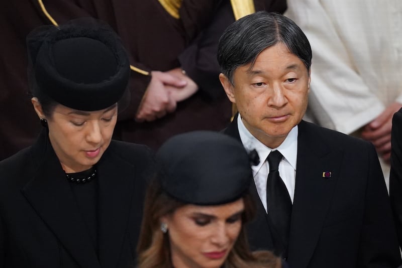 Emperor Naruhito of Japan and Empress Masako of Japan attending the state funeral of the late Queen