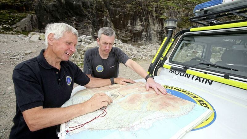 Volunteer Harry Teggarty with Martin McMullan, training officer with the Mourne Mountain Rescue Team Picture: Mal McCann 