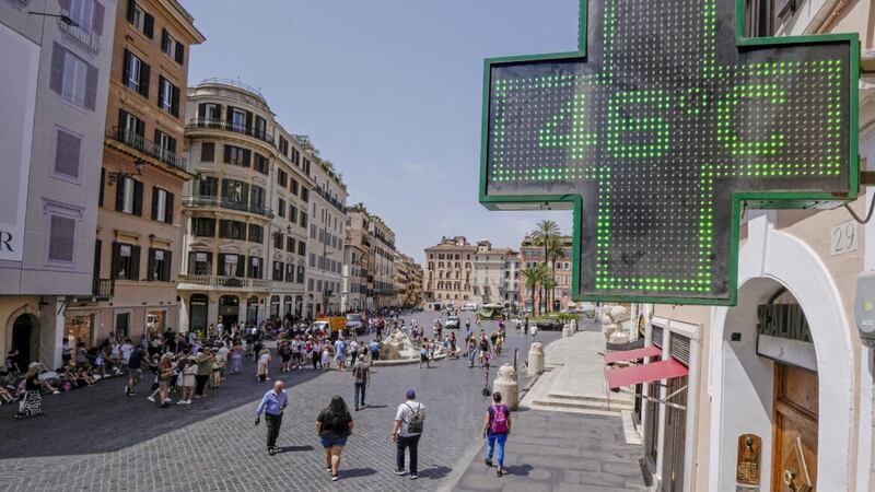 A pharmacy shop sign displays 46 Celsius in Rome this week, as a wave of record high temperatures swept across Europe 