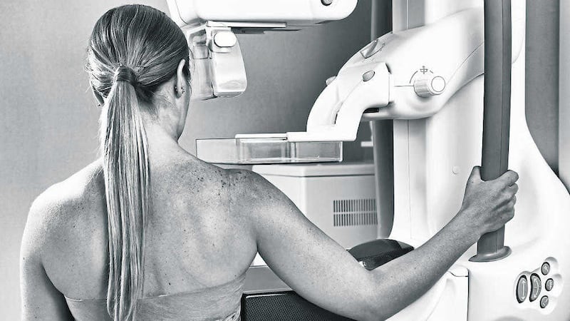 A woman in 40s undergoing a mammography test &ndash; in Northern Ireland regular breast screening only normally happens when women reach 50 
