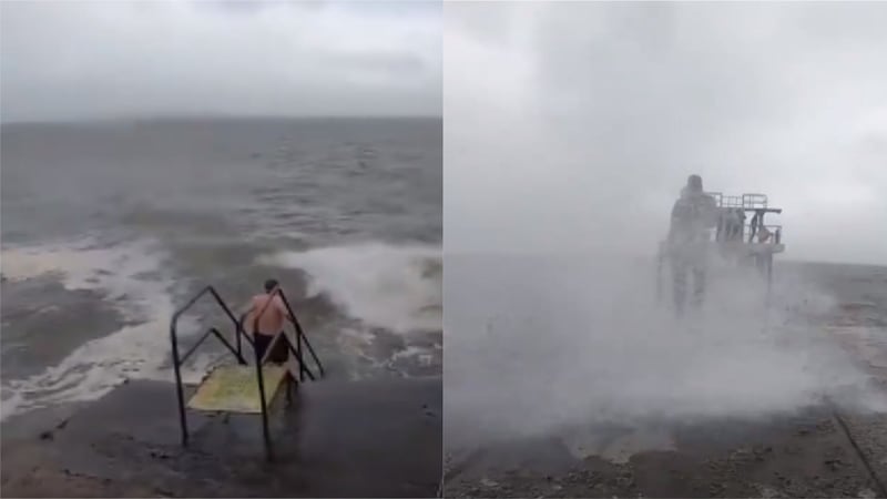 A student was filming along the coast at Blackrock when she spotted someone heading into the sea.