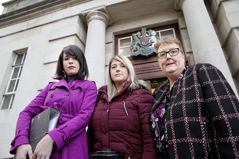 Grainne Teggart of Amnesty International with campaigner Sarah Ewart and her mother Jane at an earlier High Court hearing. Picture by Hugh Russell 