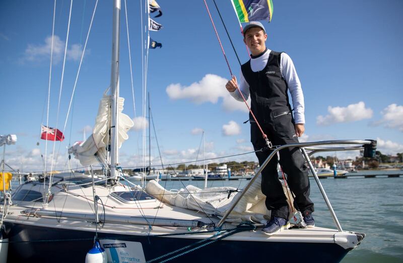 Timothy Long poses for a photograph on his 28ft boat Alchemy after arriving back into Hamble Point Marina, Hampshire