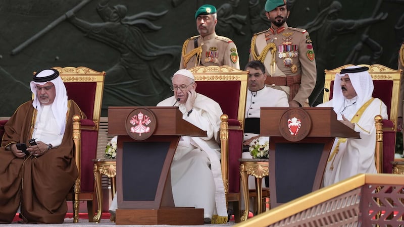 Pope Francis delivers his speech as Bahrain's Prince Salman bin Hamad Al Khalifa, left, and Bahrain's King Hamad bin Isa Al Khalifa listen at the Sakhir Royal palace, Bahrain, Friday, Nov. 4, 2022 (AP Photo/Alessandra Tarantino)