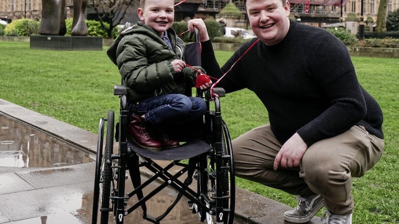 D&aacute;ith&iacute; Mac Gabhann and his father M&aacute;irt&iacute;n outside the Houses of Parliament in February. Picture: Jordan Pettitt/PA Wire. 