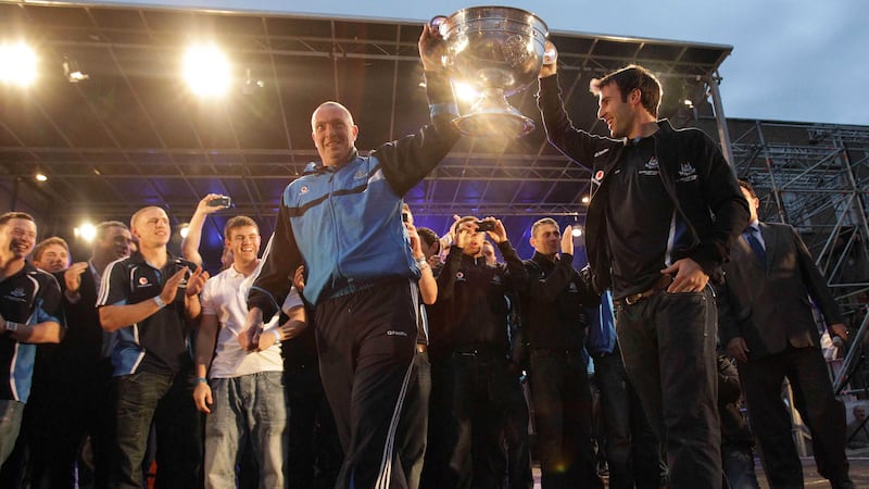 Dublin GAA manager Pat Gilroy (front left) and captain Bryan Cullen (front right) show the Sam Maguire Cup to thousands of fans gathered in Merrion Square in the Irish capital for the homecoming of the team after they beat Kerry in the All-Ireland Football Championship final in 2011