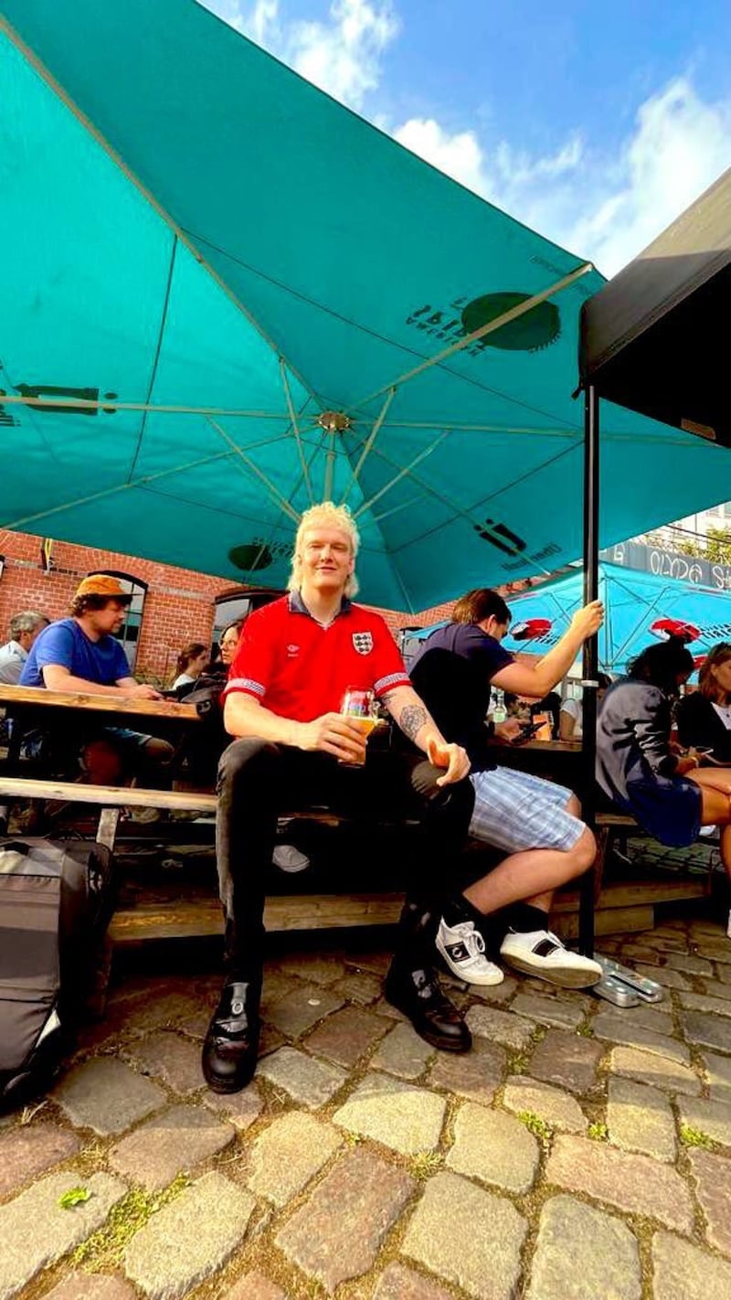 Joel Phillips watches the England v Germany game in a Hamburg pub