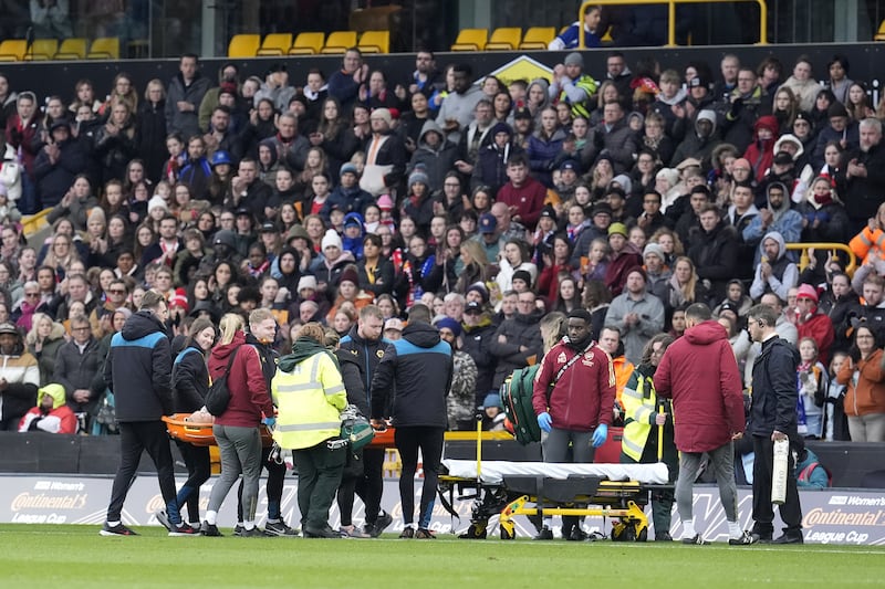 Maanum left the pitch on a stretcher after receiving treatment at Molineux
