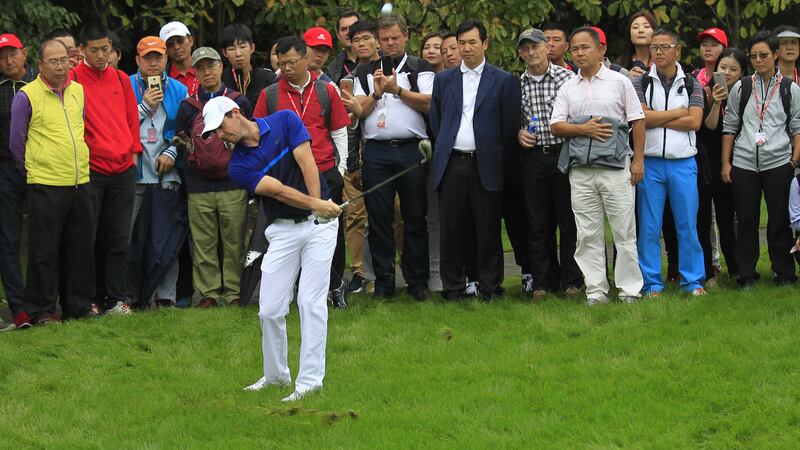 Rory McIlroy of Northern Ireland hits a shot from the grass on the second hole during the second round of the HSBC Champions golf tournament at the Sheshan International Golf Club in&nbsp;Shanghai on&nbsp;Friday&nbsp;