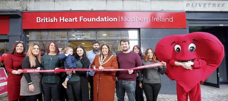 Belfast Lord Mayor Deirdre Hargey and D&aacute;ith&iacute; Mac Gabhann alongside his parents Seph and M&aacute;irt&iacute;n join BHF shop staff and volunteers to cut the ribbon at the new popup shop in Fountain Street. Picture by Presseye/ BHF NI 