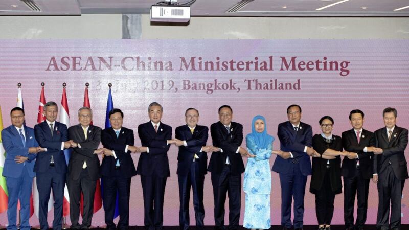 Chinese foreign minister Wang Yi, fifth from left, reaffirmed Beijing&#39;s commitment to conclude a code of conduct with ASEAN governing the South China Sea that will make the disputed region more stable. Picture by Gemunu Amarasinghe/AP 
